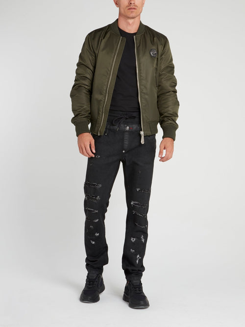 Черные джинсы на шнуровке с рваной отделкой