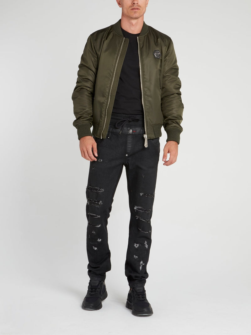 Черные джинсы на шнуровке с рваной отделкой