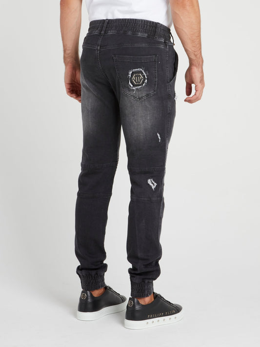 Черные спортивные брюки с рваной отделкой