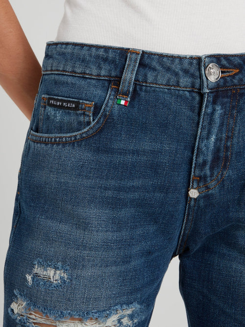 Синие джинсы-бойфренды с рваной отделкой