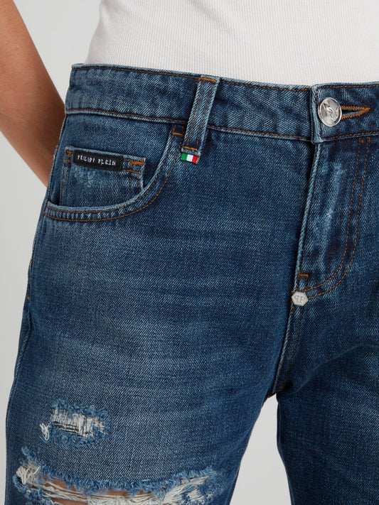 Синие джинсы-бойфренды с рваной отделкой