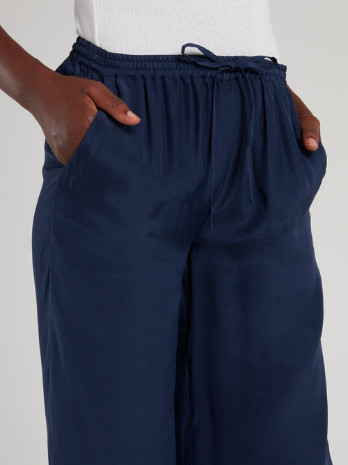 Темно-синие брюки палаццо со шнурком