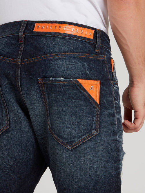 Темно-синие бермуды с рваной отделкой