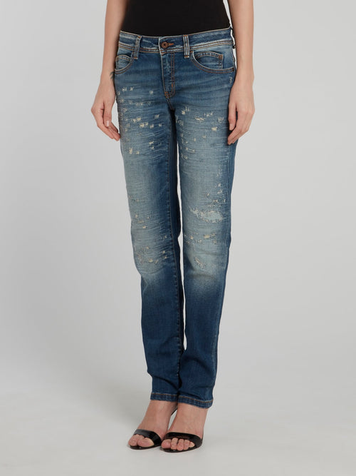 Темно-синие джинсы с рваной отделкой