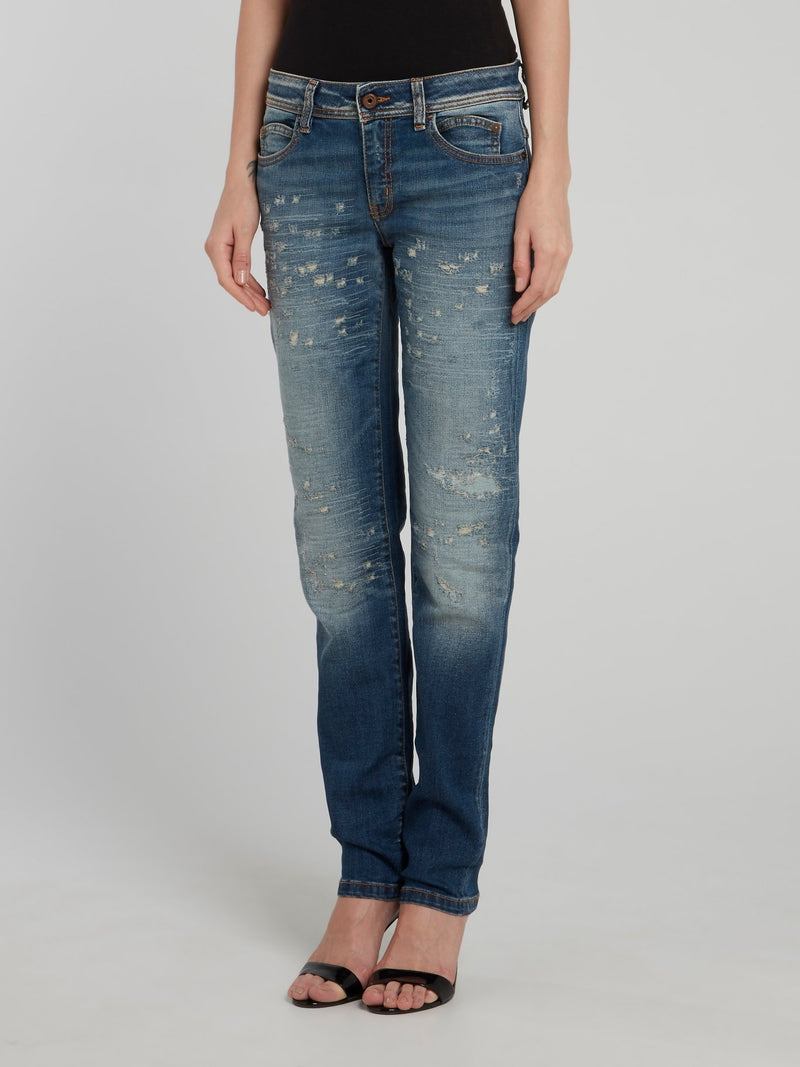 Темно-синие джинсы с рваной отделкой