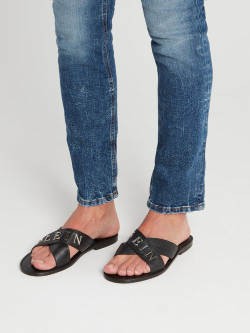 Черные кожаные шлепанцы с ремешками крест-накрест и логотипом