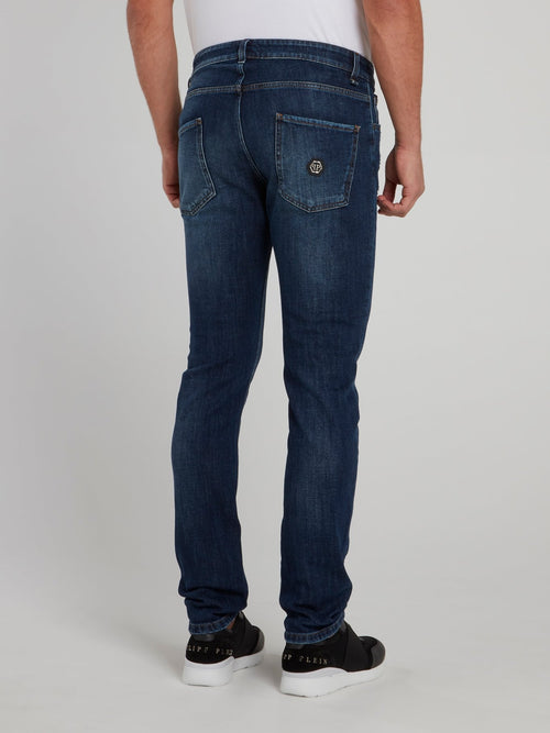 Выбеленные джинсы с рваной отделкой