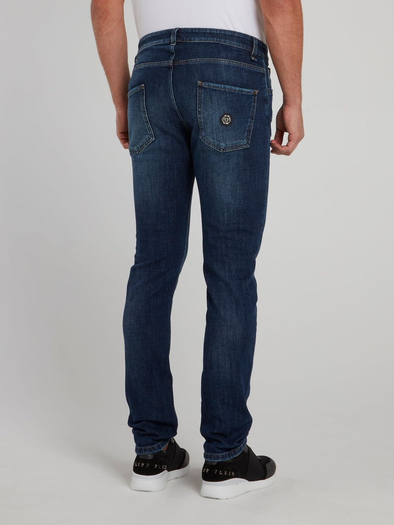 Выбеленные джинсы с рваной отделкой