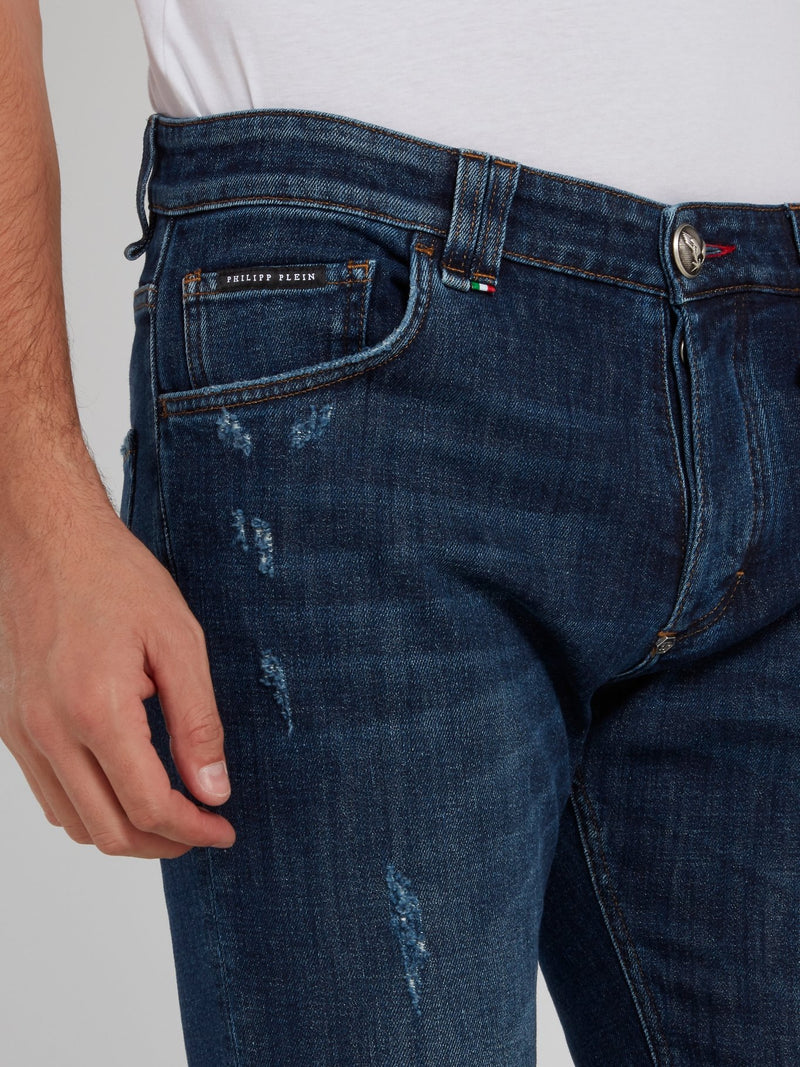 Выбеленные джинсы с рваной отделкой