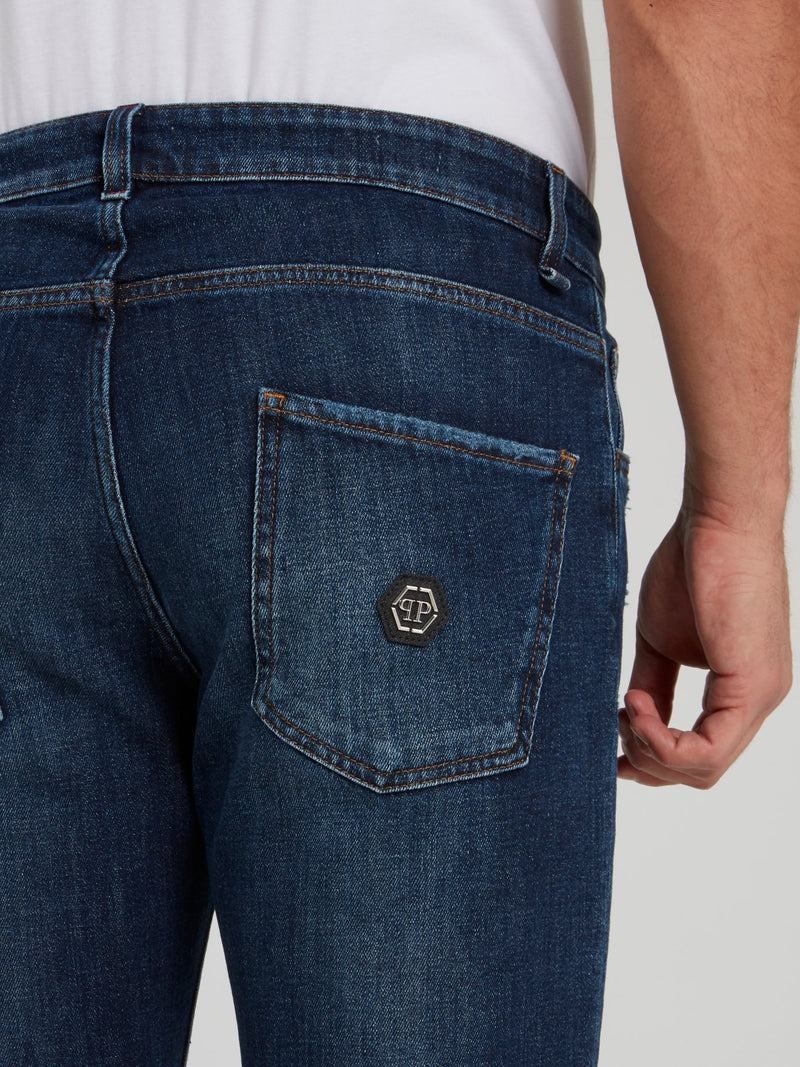 Выбеленные джинсы с рваной отделкой