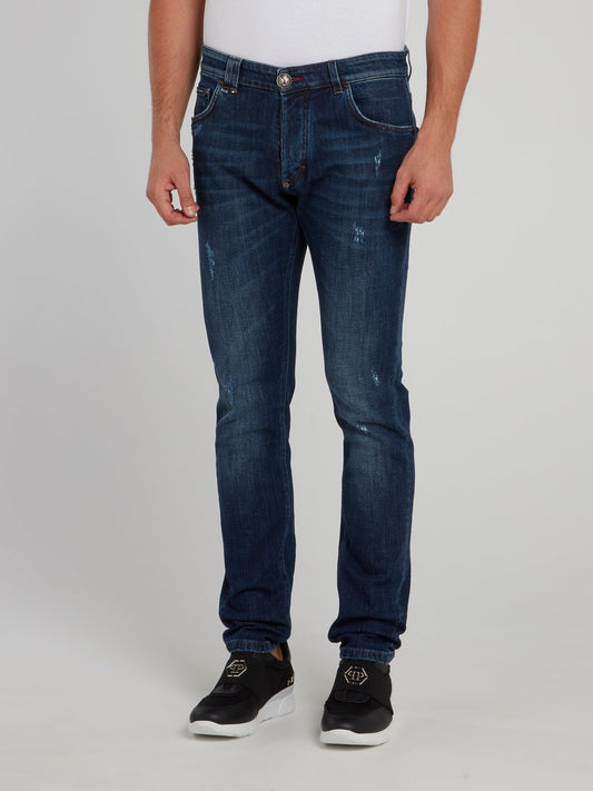 Выбеленные джинсы с рваной отделкой