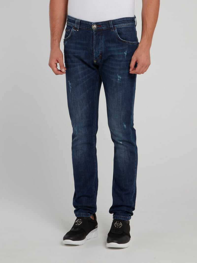 Выбеленные джинсы с рваной отделкой