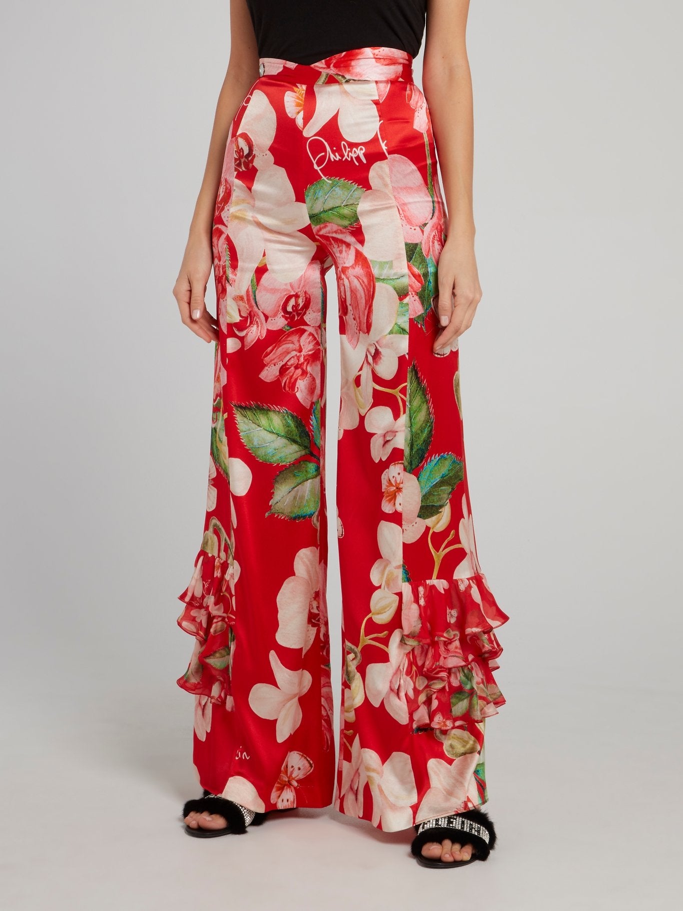 Красные расклешенные брюки с оборками и цветочным принтом