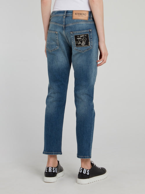 Синие джинсы-бойфренды с рваной отделкой