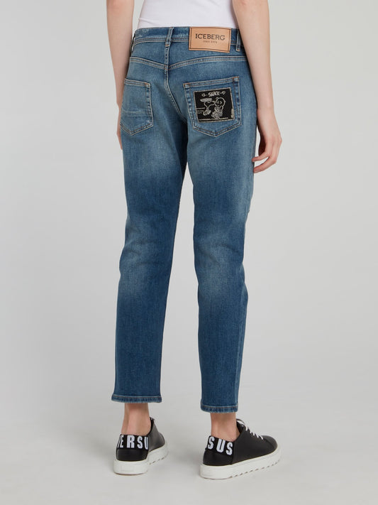 Синие джинсы-бойфренды с рваной отделкой