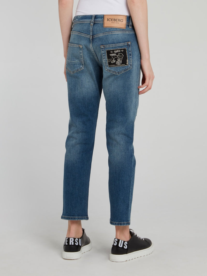 Синие джинсы-бойфренды с рваной отделкой