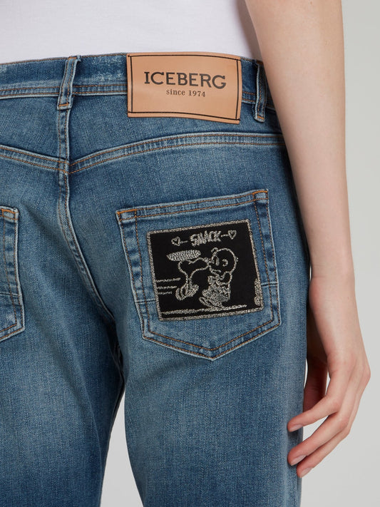 Синие джинсы-бойфренды с рваной отделкой