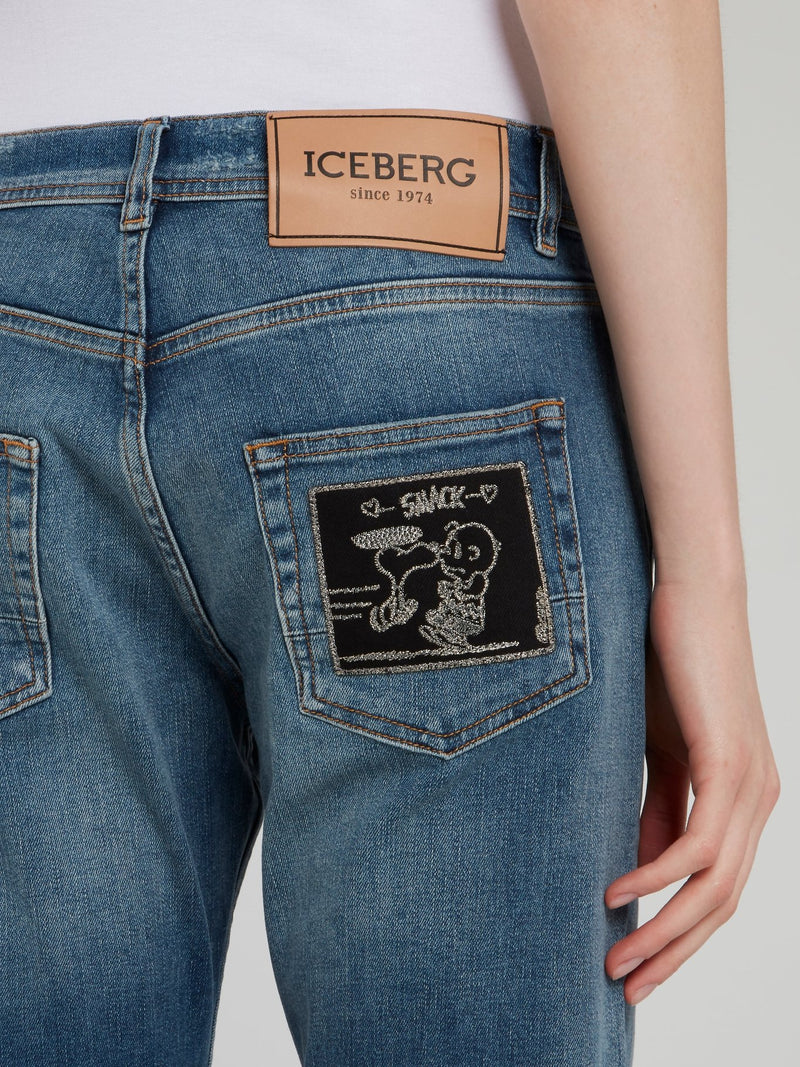 Синие джинсы-бойфренды с рваной отделкой