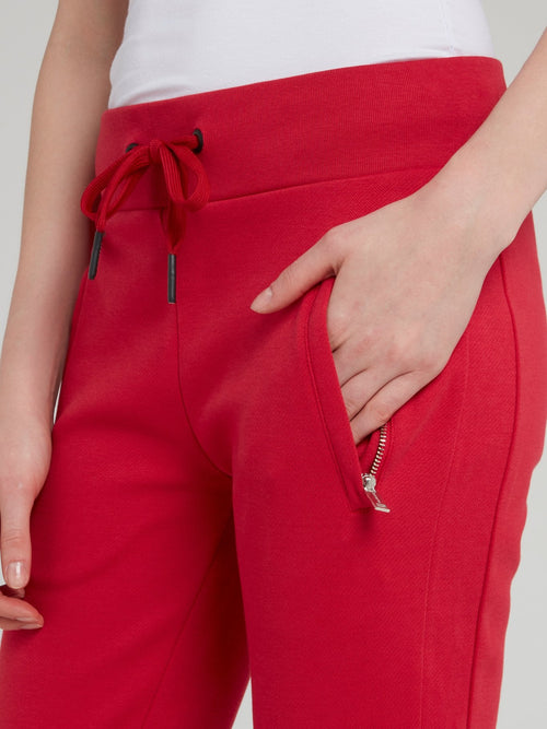 Красные спортивные брюки со шнурком и логотипом