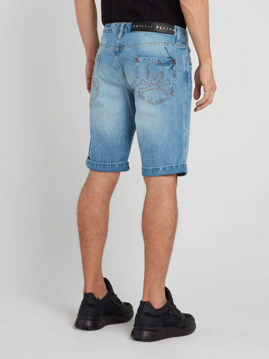 Синие джинсовые шорты с рваной отделкой