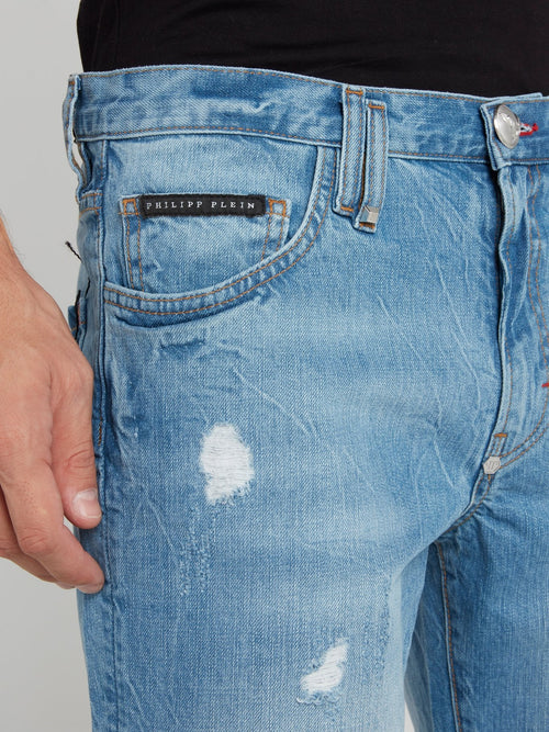 Синие джинсовые шорты с рваной отделкой