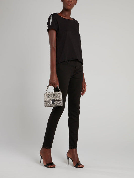 Черные брюки с декором на карманах