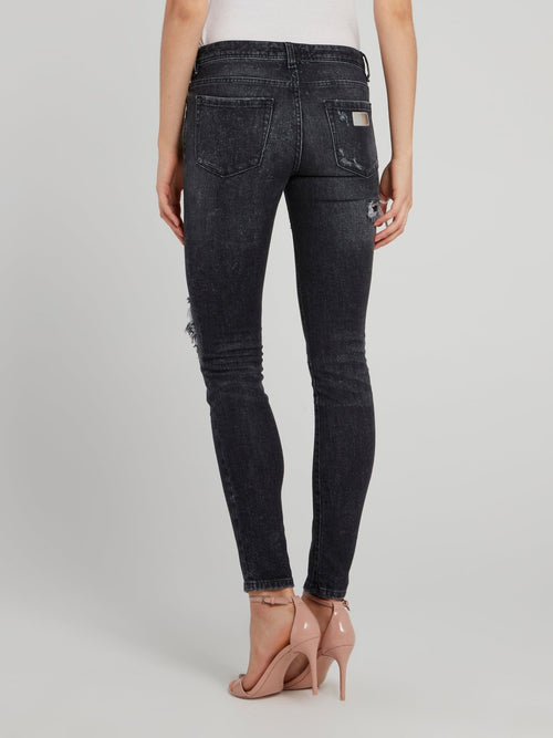 Черные джинсы скинни с рваной отделкой
