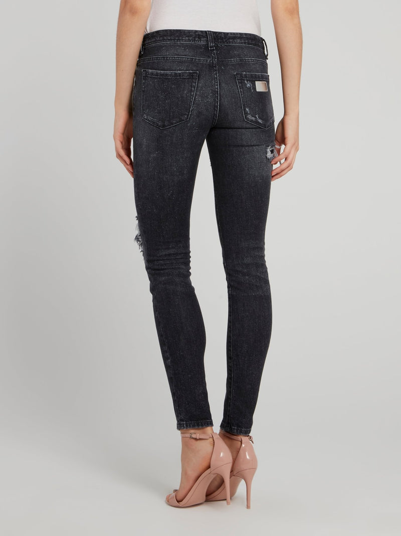 Черные джинсы скинни с рваной отделкой