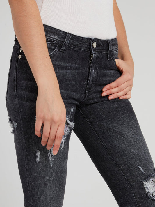 Черные джинсы скинни с рваной отделкой