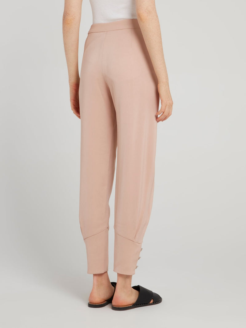 Бежевые зауженные брюки с манжетами