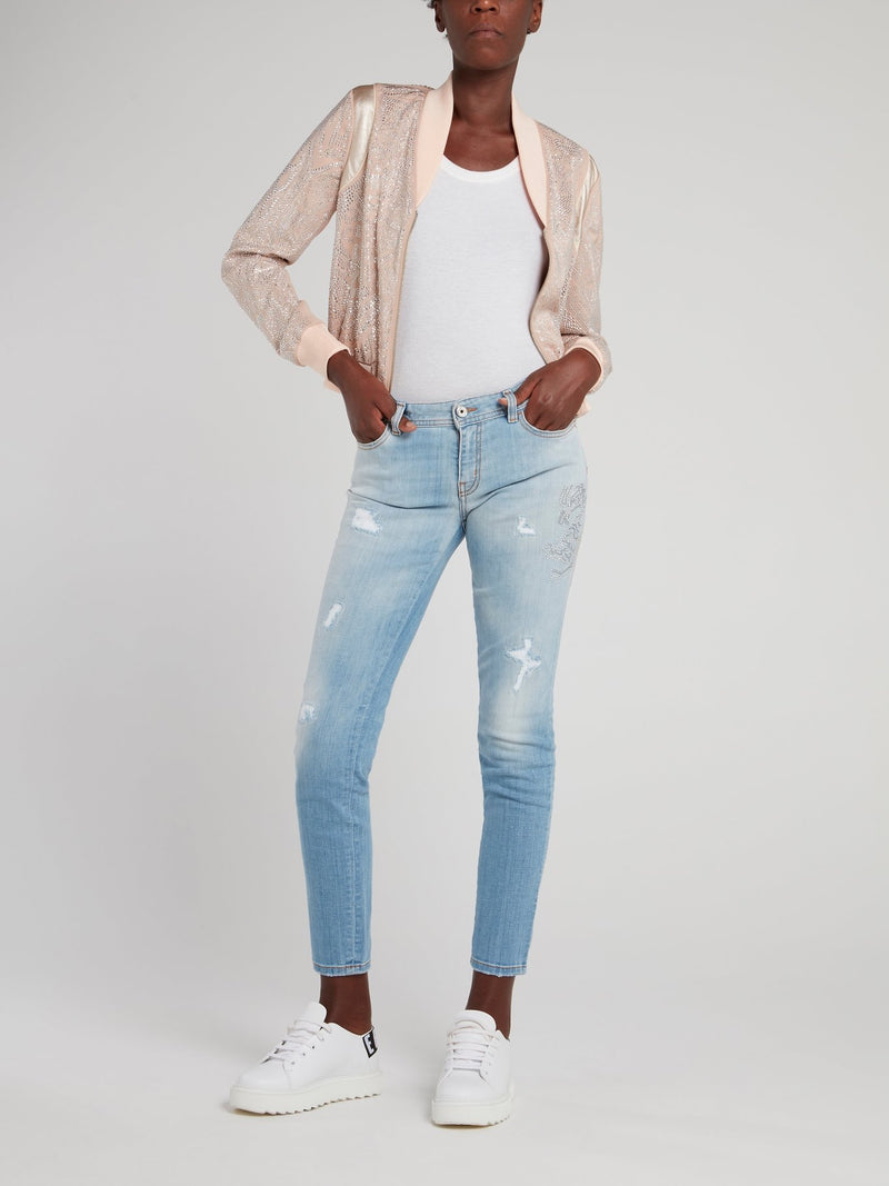 Синие джинсы с рваной отделкой и эффектом кислотной стирки