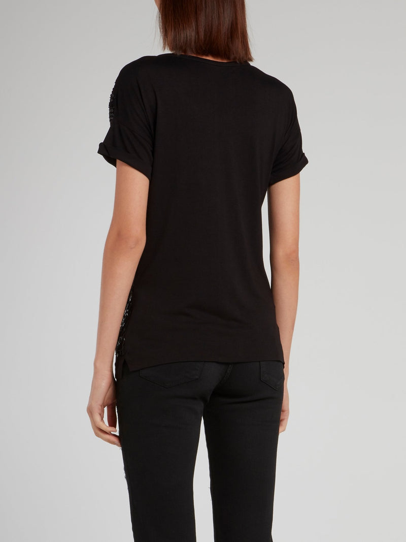 Черная блузка с глубоким круглым вырезом и вышивкой бисером