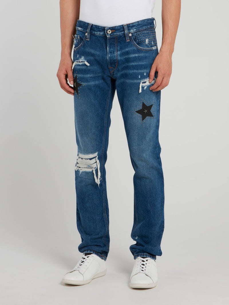 Синие джинсы с рваной отделкой и стразами