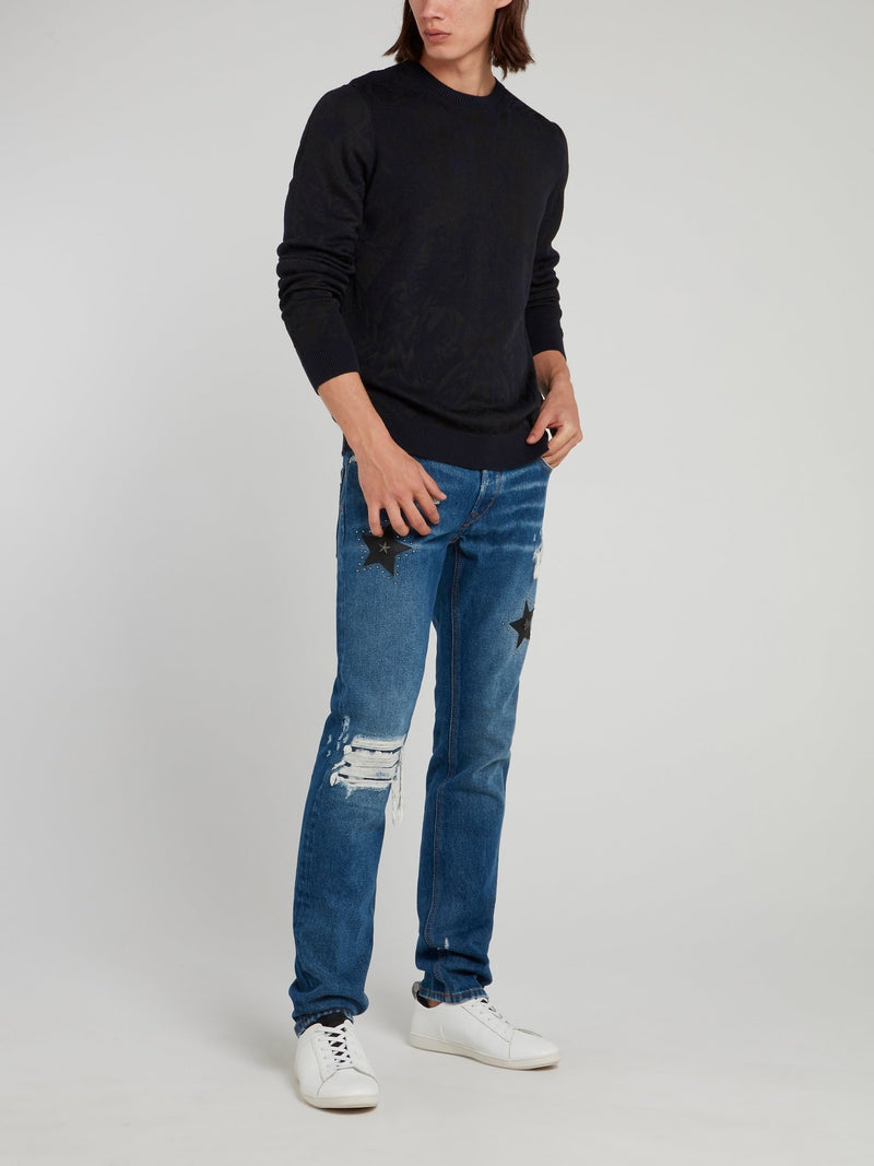 Синие джинсы с рваной отделкой и стразами