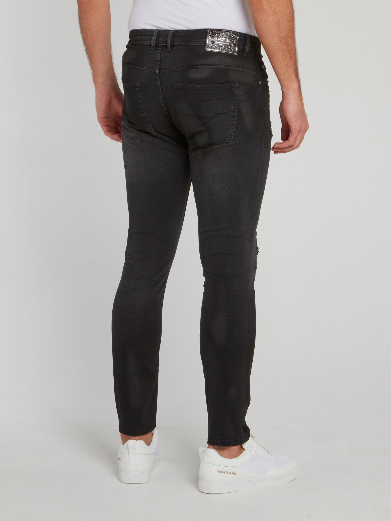 Черные джинсы стретч с рваной отделкой