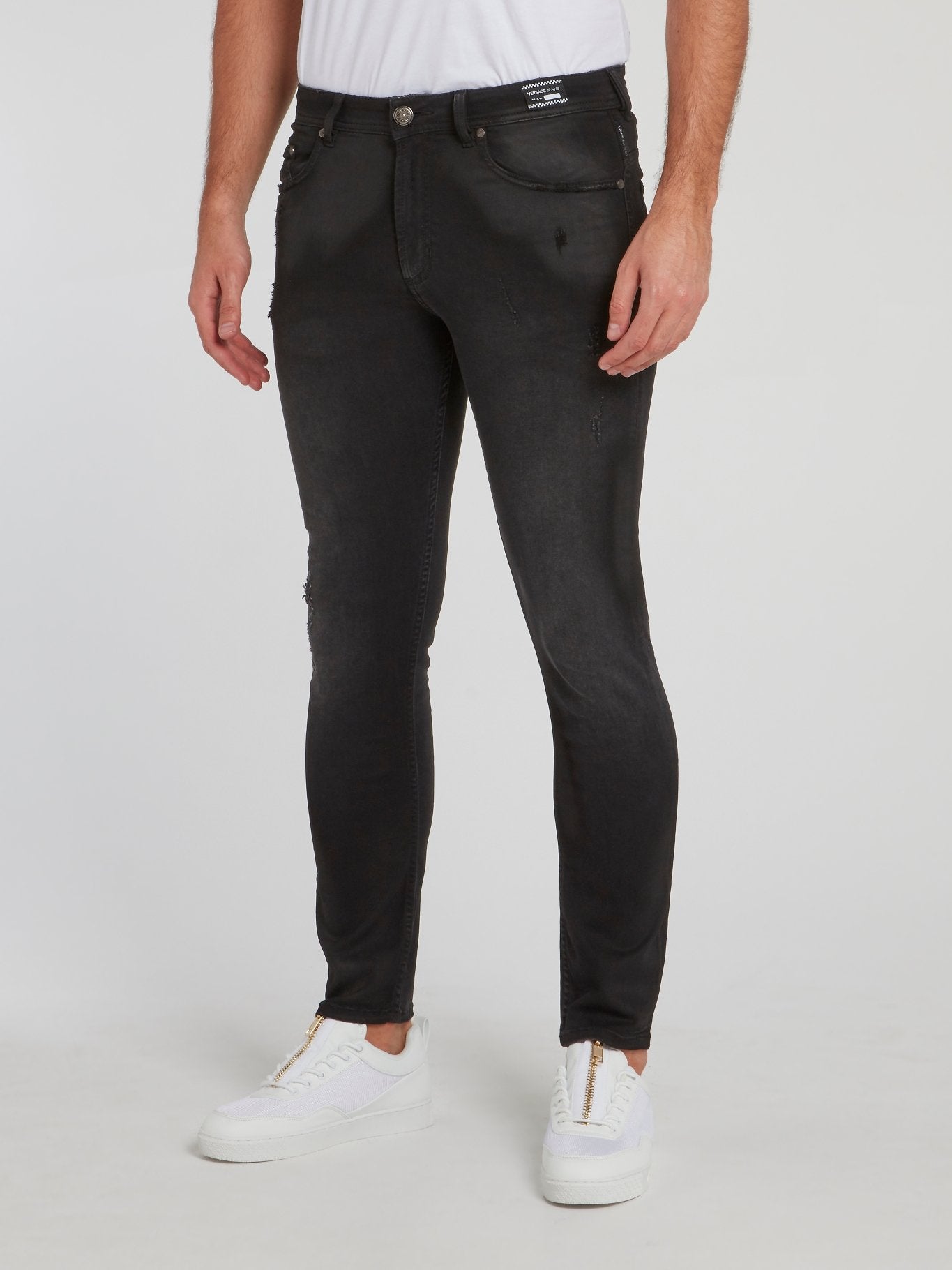 Черные джинсы стретч с рваной отделкой