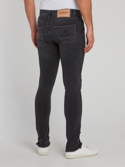 Черные джинсы скинни с рваной отделкой