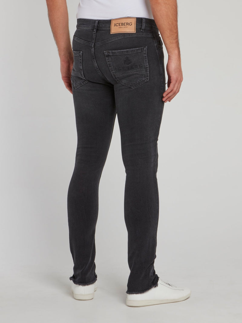 Черные джинсы скинни с рваной отделкой