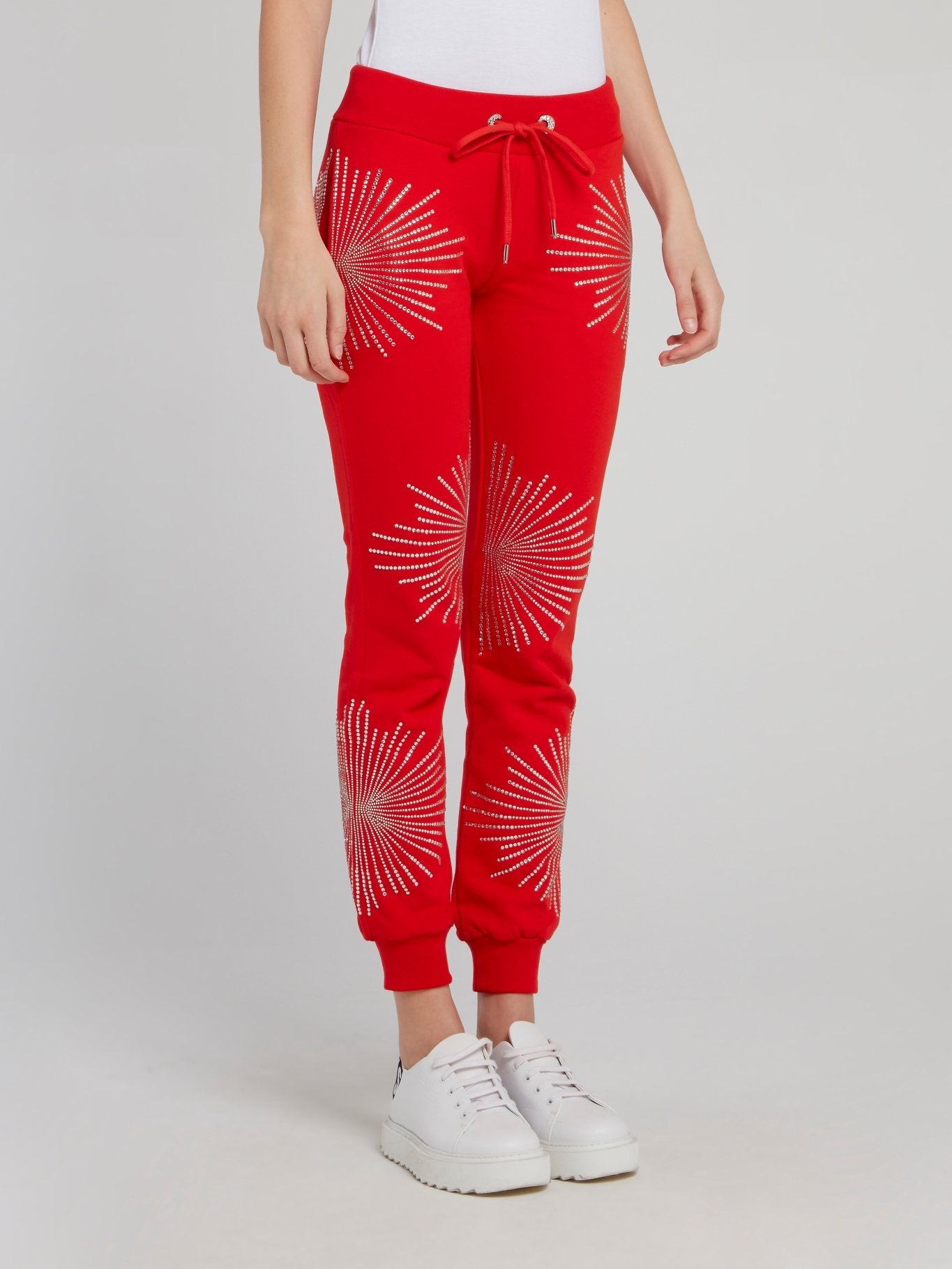 Красные спортивные брюки со стразами