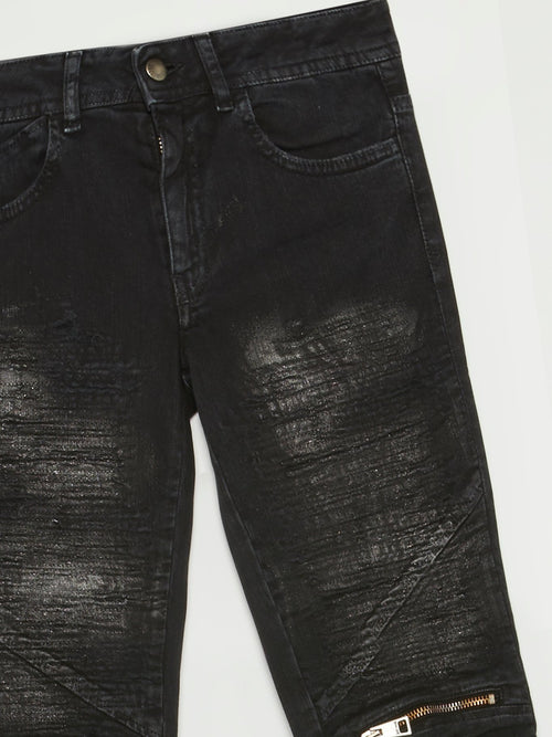 Черные джинсы с молниями на коленях