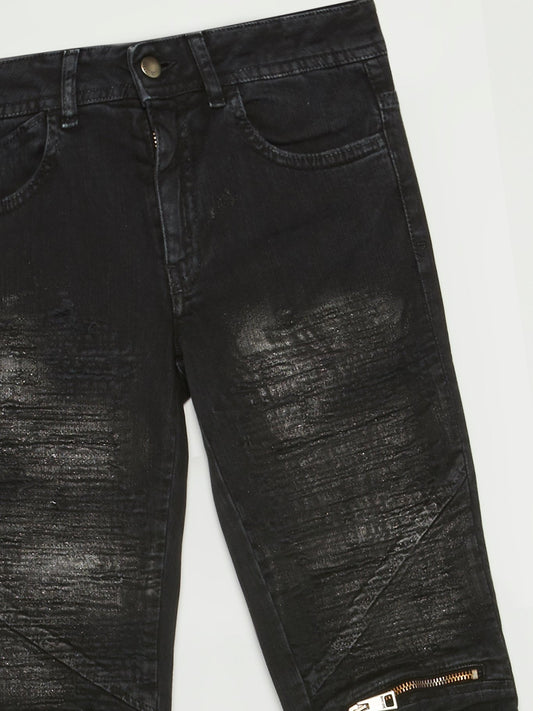Черные джинсы с молниями на коленях