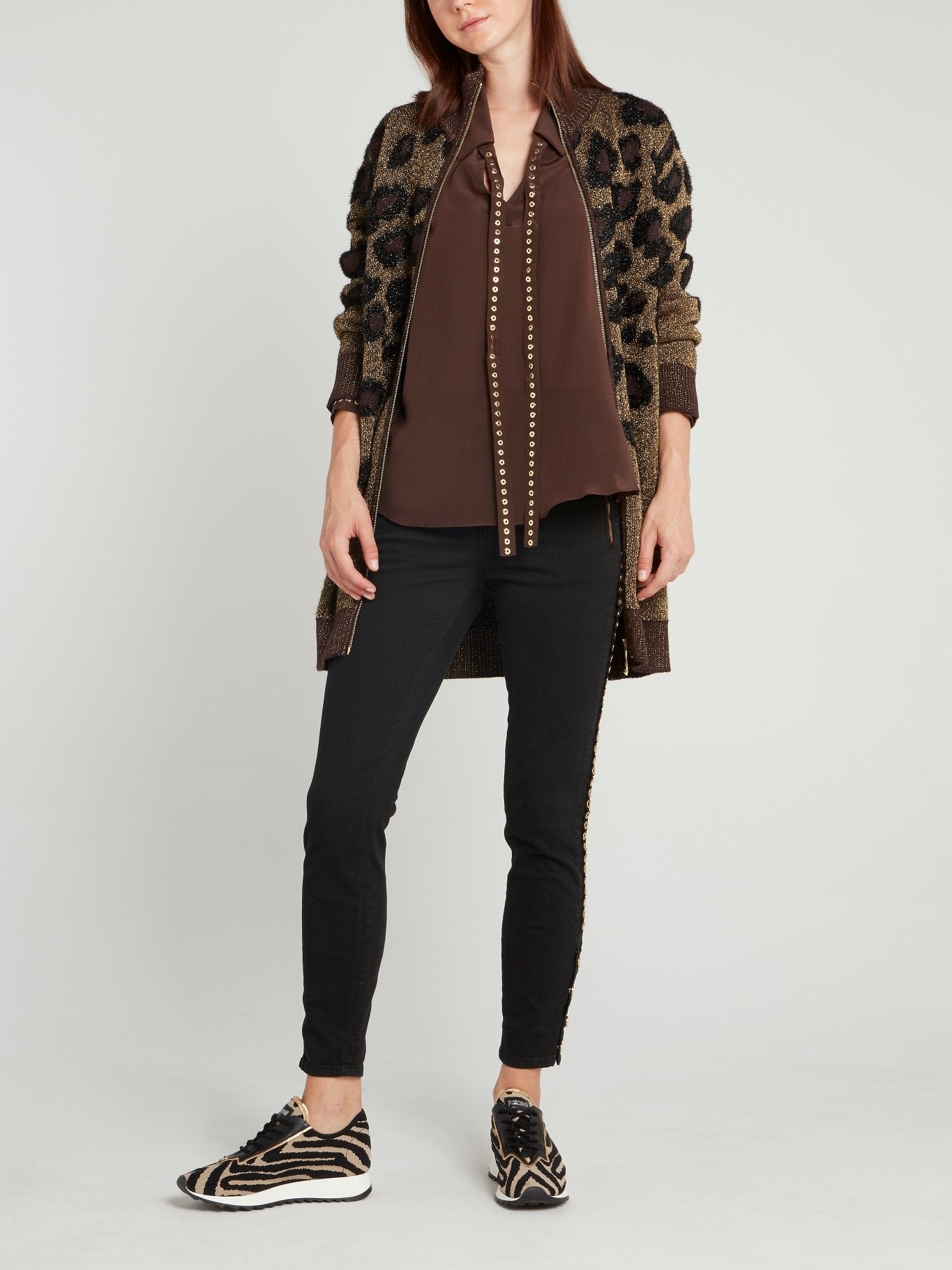 Черные джинсы скинни с люверсами