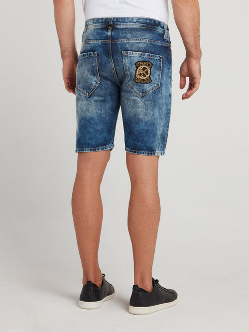 Синие джинсовые шорты с рваной отделкой