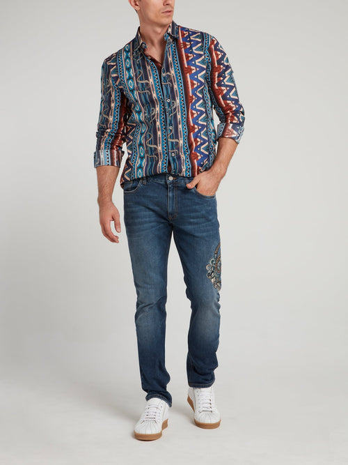 Синие джинсы с вышивкой