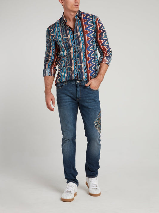 Синие джинсы с вышивкой