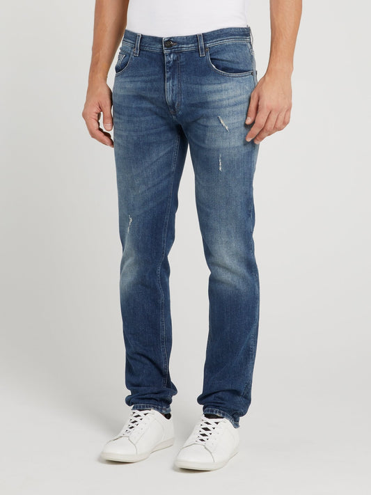 Синие джинсы с рваной отделкой